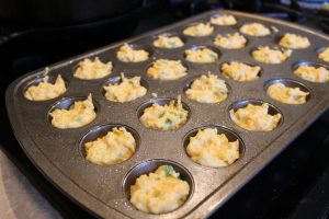 muffin tin full of Cheddar Jalapeno Cornbread Muffins