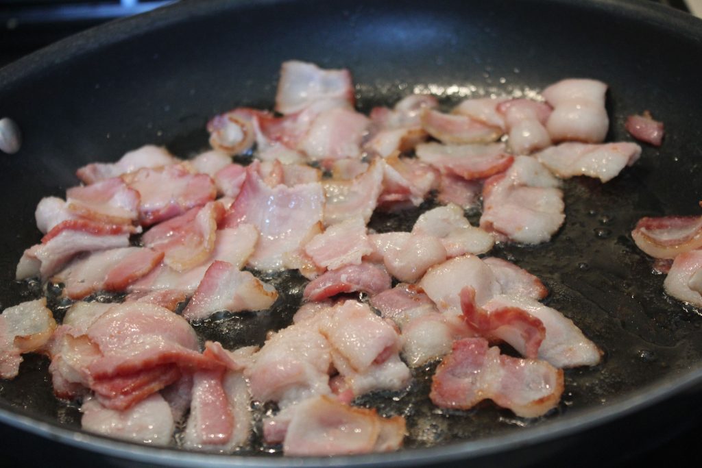 bacon pieces cooking