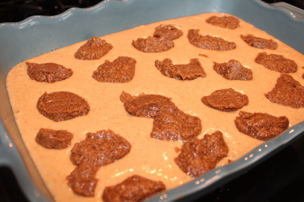 dabs of cinnamon mixture added to cake batter