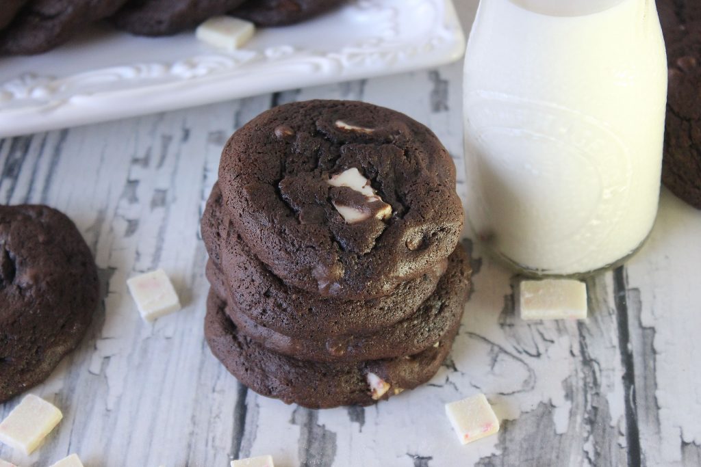 a stack of peppermint mocha cookies next to milk