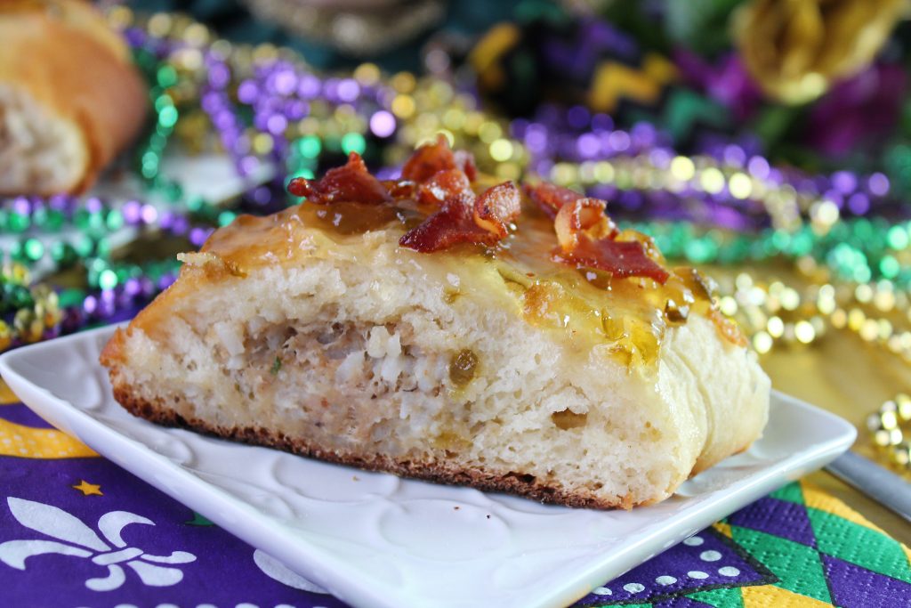 Slice of boudin stuffed king cake