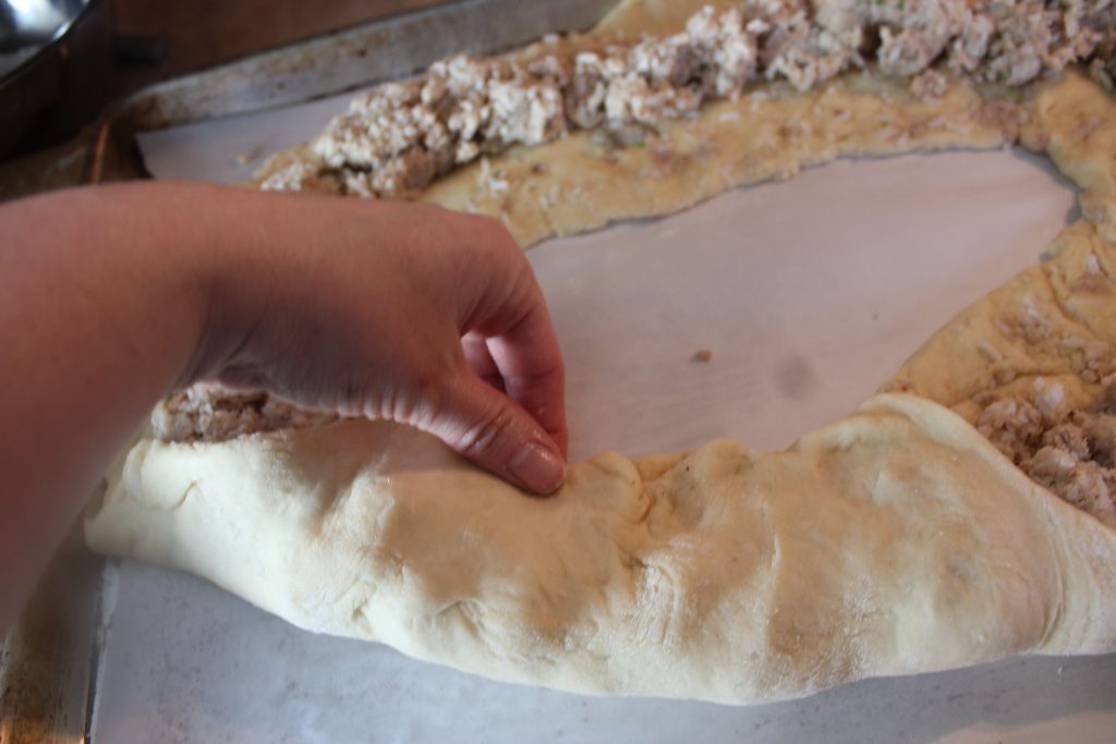 stuffing dough with boudin