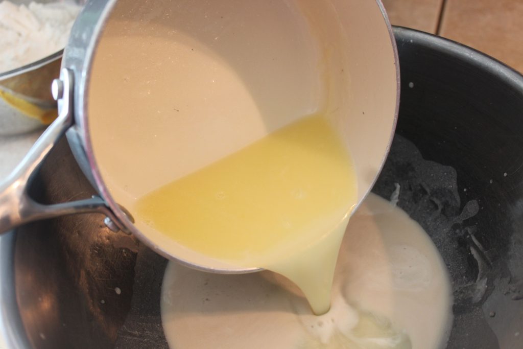pouring butter into yeast mixture