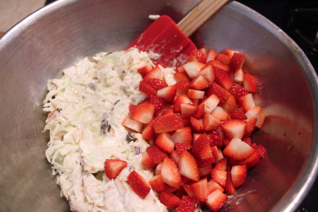 mixing in the strawberries