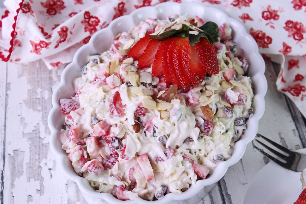 Strawberry Lemon Coleslaw in a white serving bowl