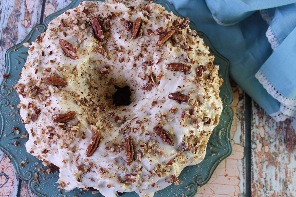 Hummingbird Cake With cream cheese filling on a blue platter