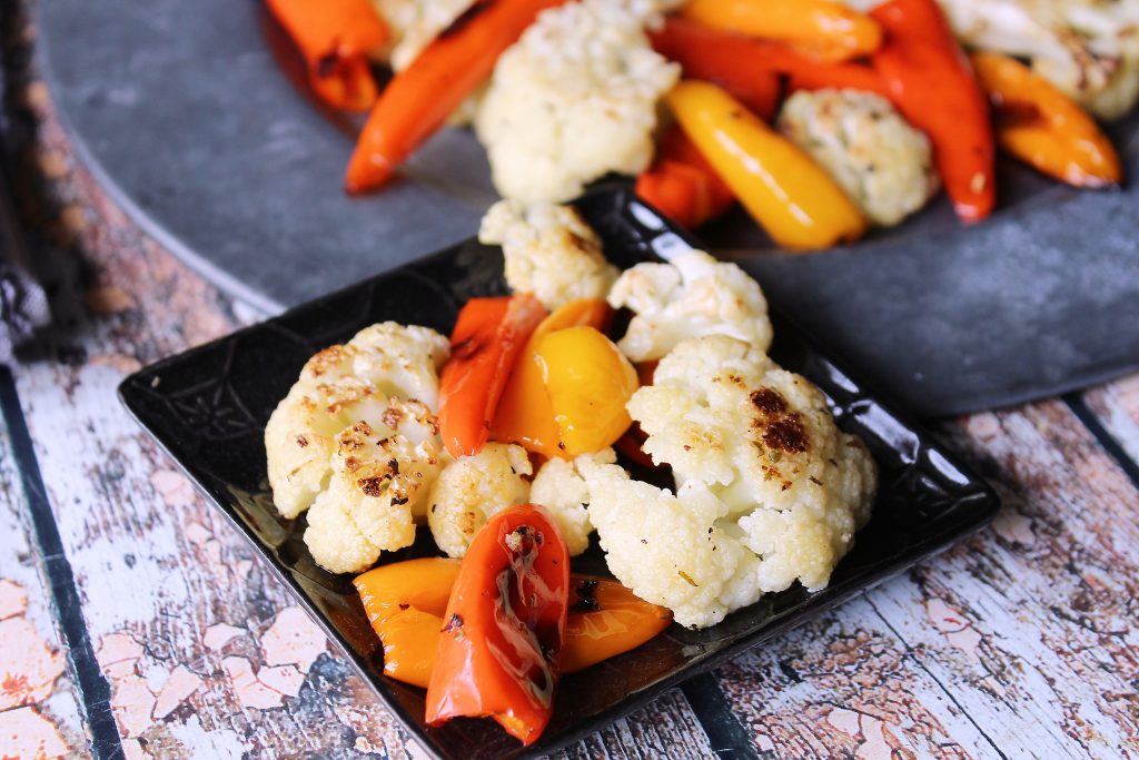 a serving of Roasted Cauliflower with Sweet Mini Peppers on a plate