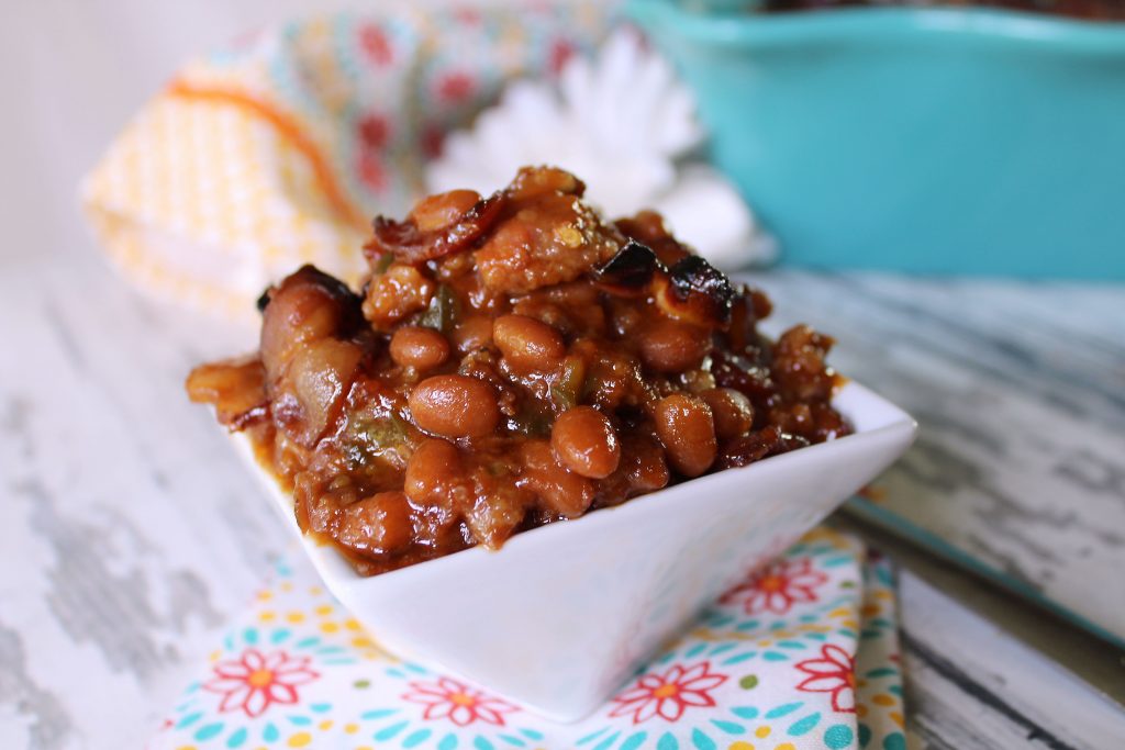 single serving angry pig baked beans in a white dish