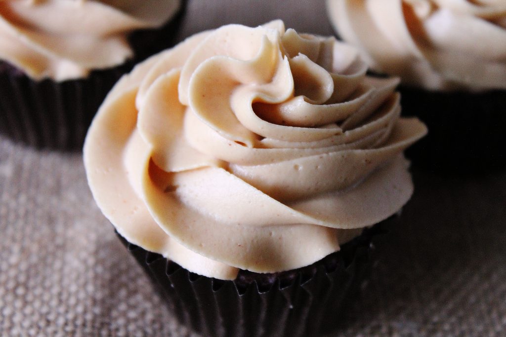 Creamy Peanut Butter Frosting on a chocolate cupcake
