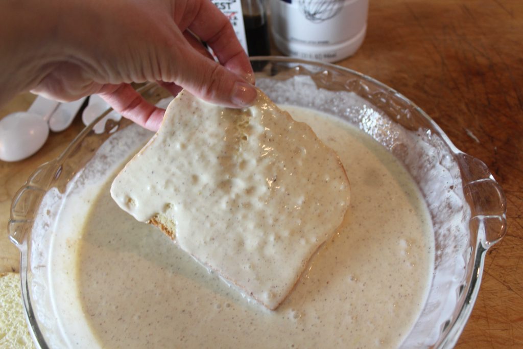 Dipping bread in eggs mixture