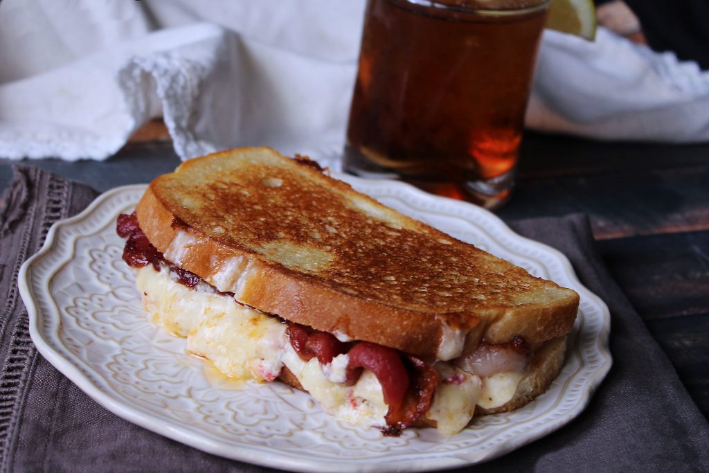 a whole Smoked Gouda Grilled Cheese on a plate