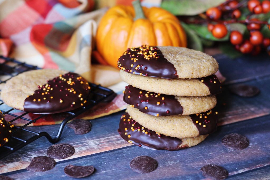 chocolate dipped pumpkin cookies stacked 