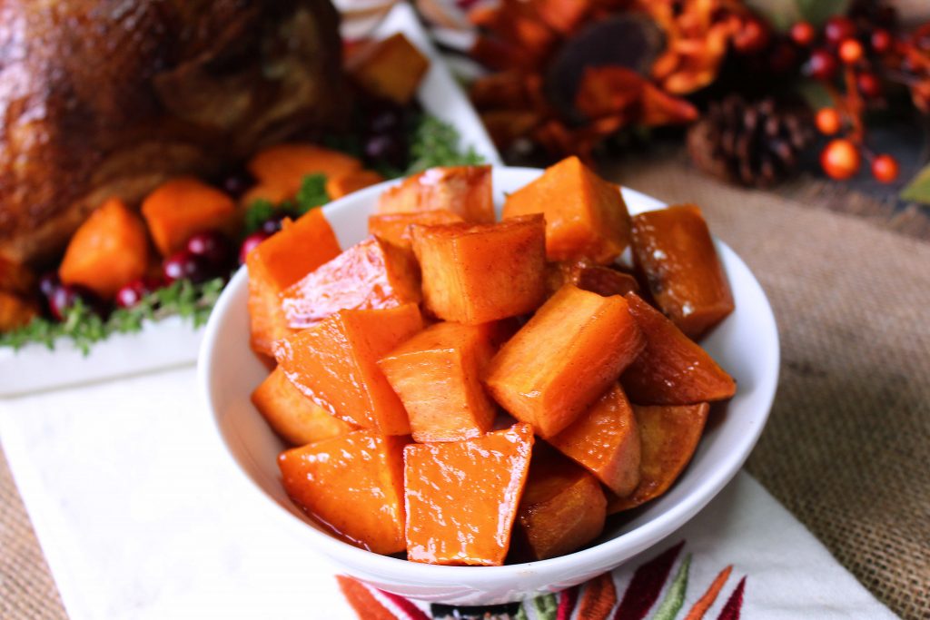 Easy Roasted Sweet potatoes next to a turkey