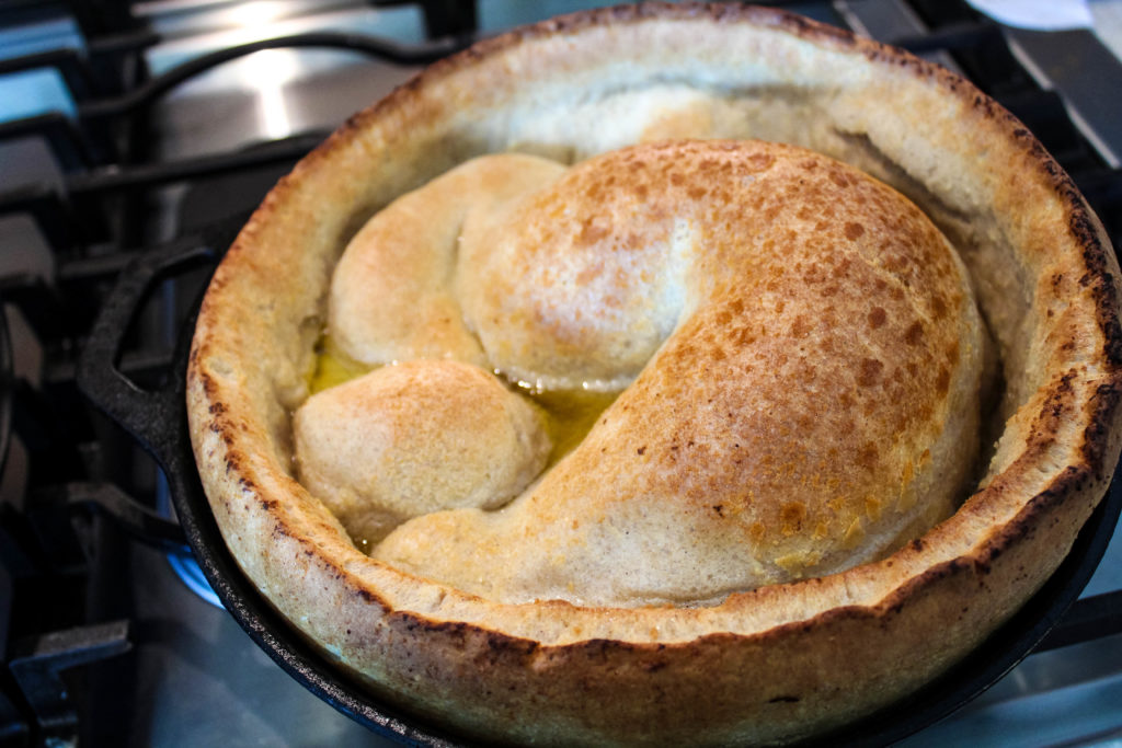 Dutch baby big and puffy out of the oven