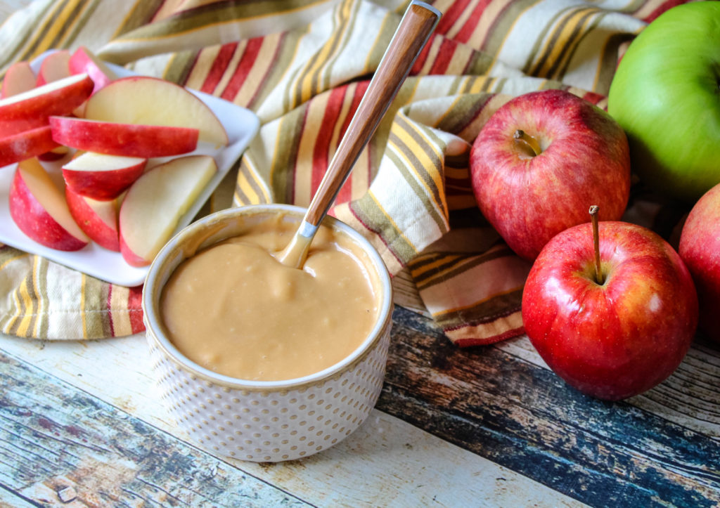 Caramel Ganache in a bowl with apples around it