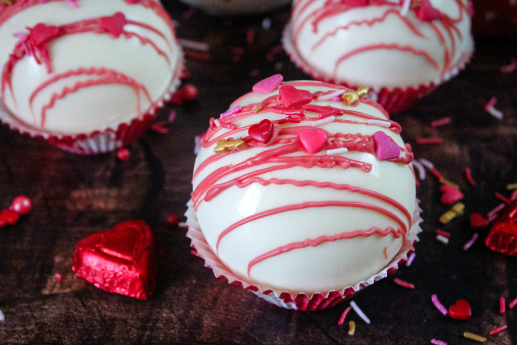 Pink Hot Cocoa Bombs with valentine sprinkles