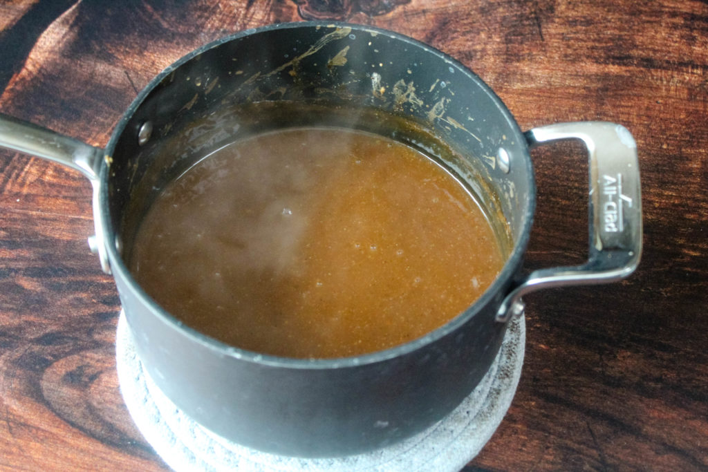 Brown Gravy cooked in a sauce pan. 