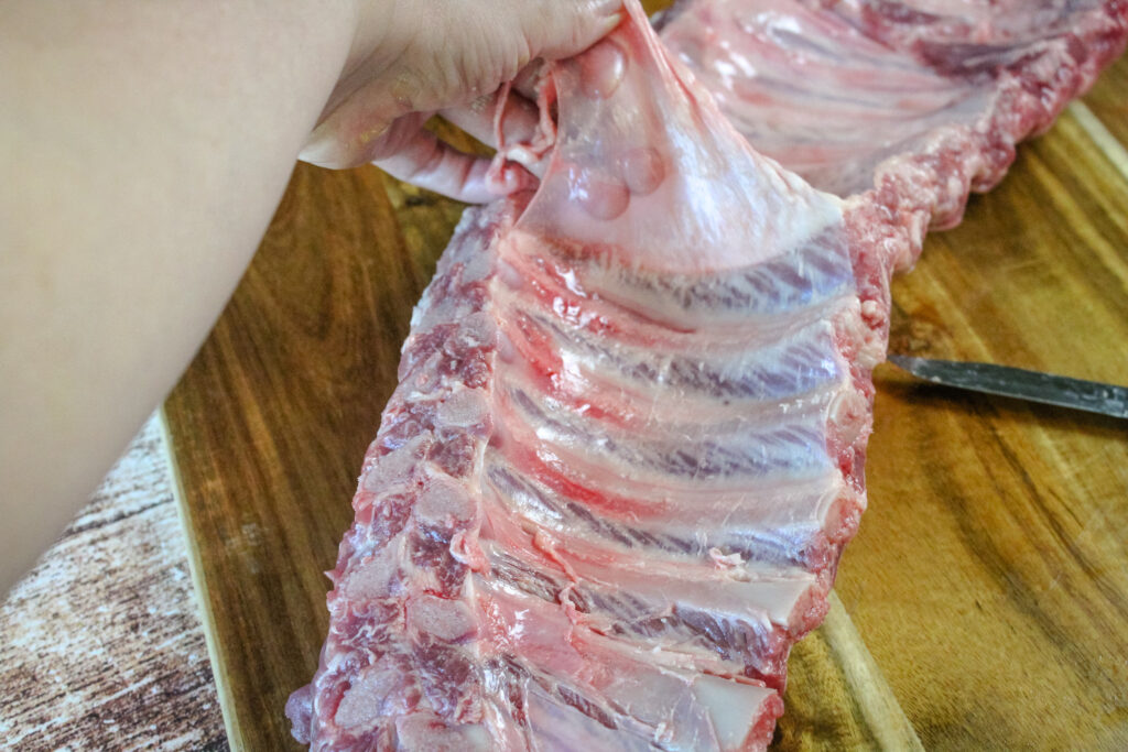 Taking the thin membrane off the back of the ribs