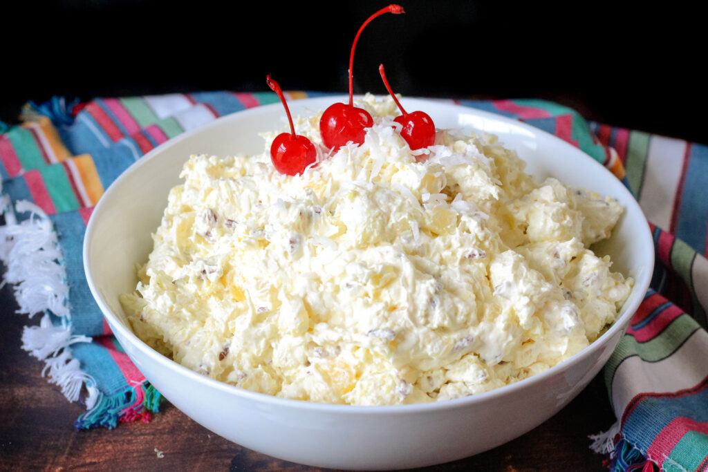 Pina Colada Fluff in a large white serving bowl