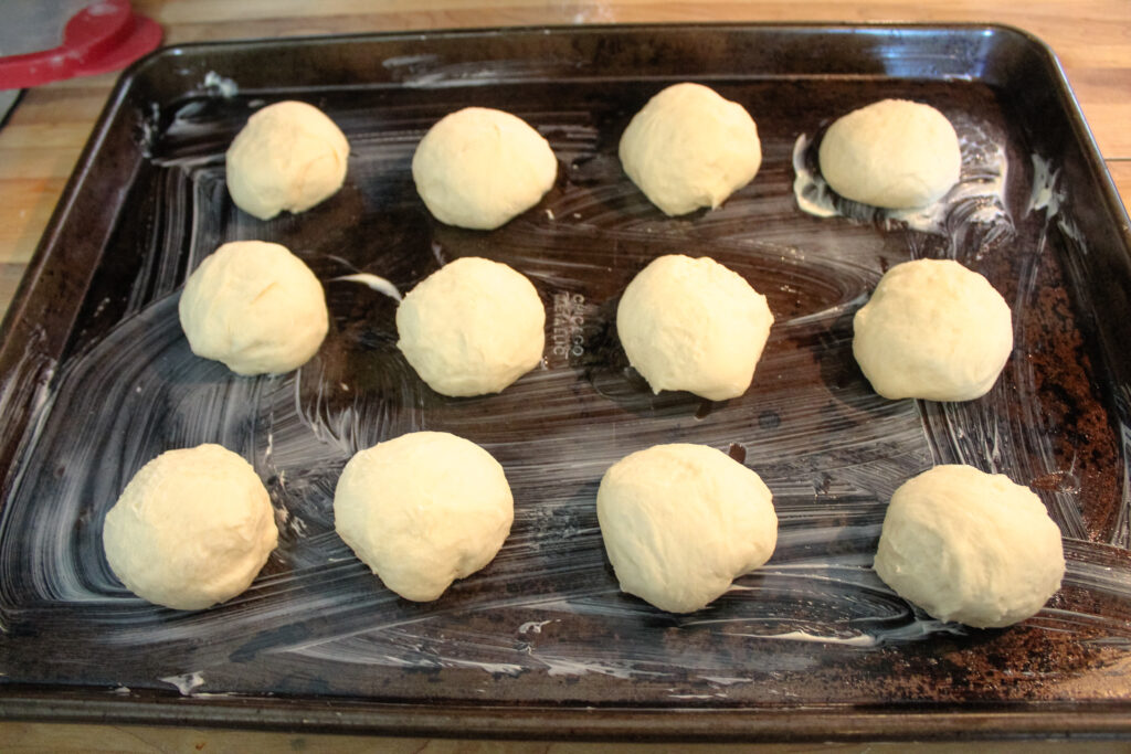 Dough Balls on a buttered baking pan