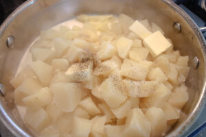 Cooked cubed potatoes with butter