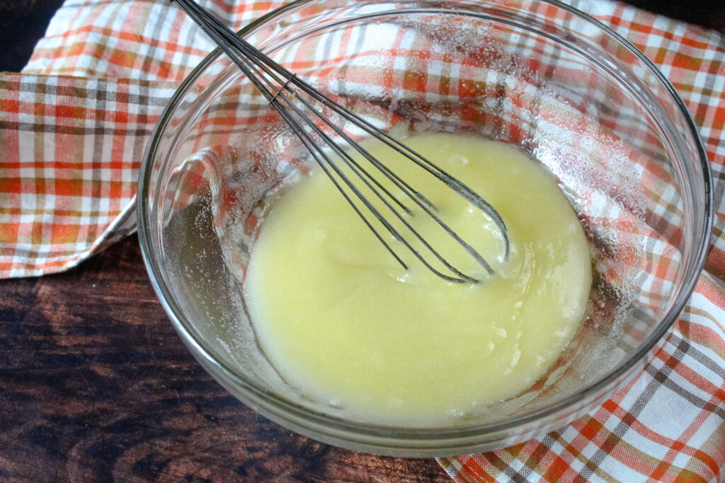 Eggs, sugar and oil beaten together in a mixing bowl