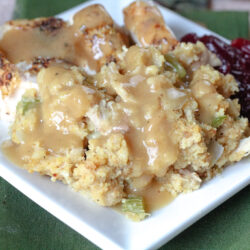 southern cornbread dressing on a plate with gravy