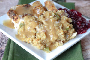 southern cornbread dressing on a plate with gravy