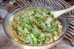 adding cooked onions and celery to cornbread mixture