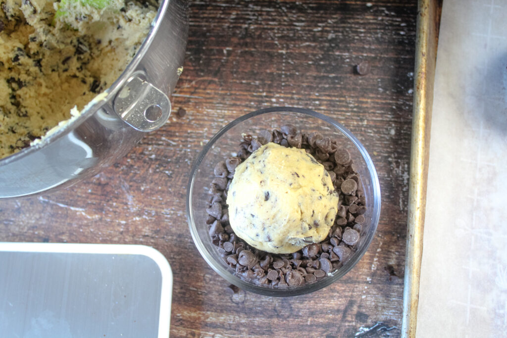 Coating cookie dough ball with chocolate chips