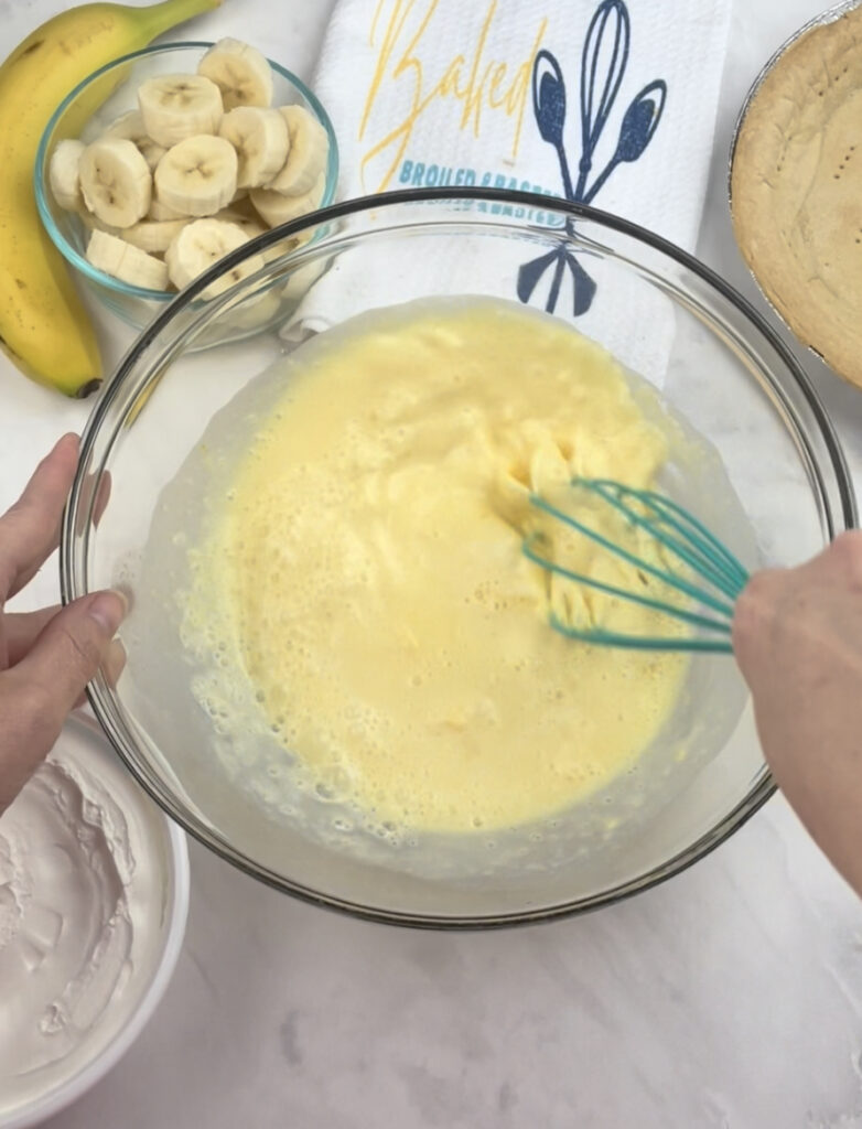whisking the pudding mix for the easy banana cream pie 