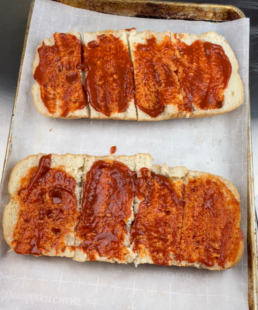 The pizza sauce added to make French bread pizza 