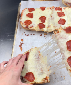perfect cheese pull on French bread pizza