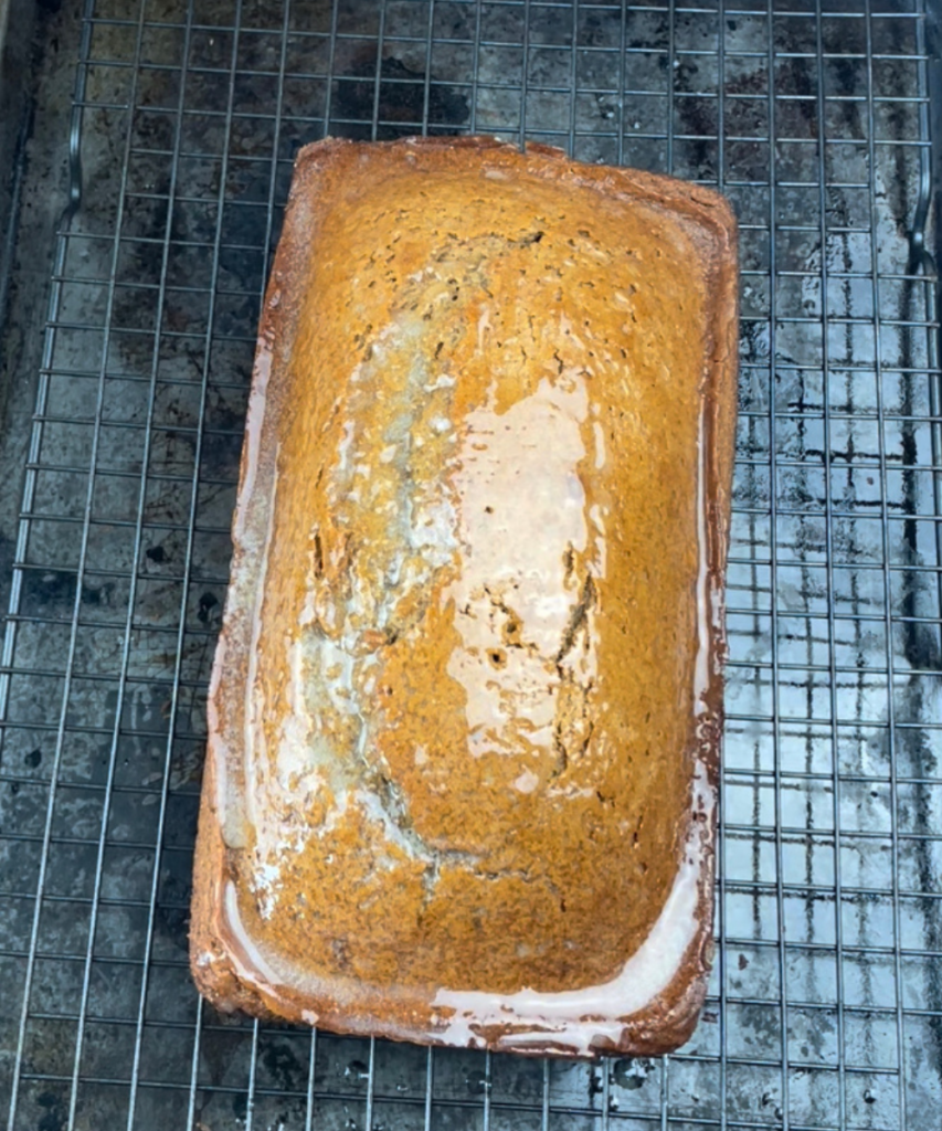 Apple cider bread after it comes out of the oven with butter brush on the outside 
