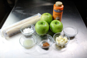 All of the ingredients for an apple galette .