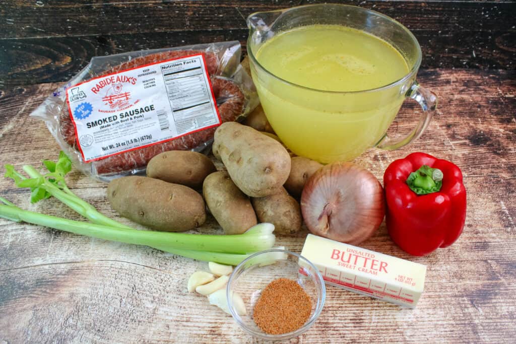 Ingredients needed for Cajun sausage potato soup. Potatoes , onion , bell pepper, celery , butter garlic, sausage and chicken broth 