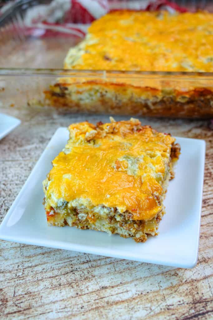 a square cut of cattle drive casserole on a small white plate