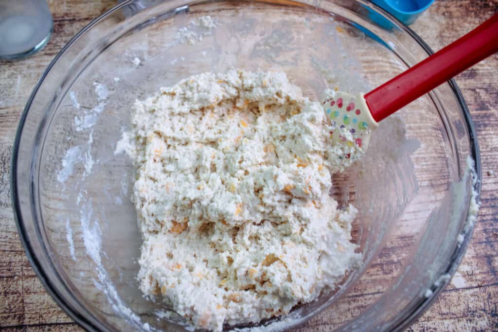 The cheddar bay mix mixed up in a bowl ready to place the bottom layer of cattle drive casserole
