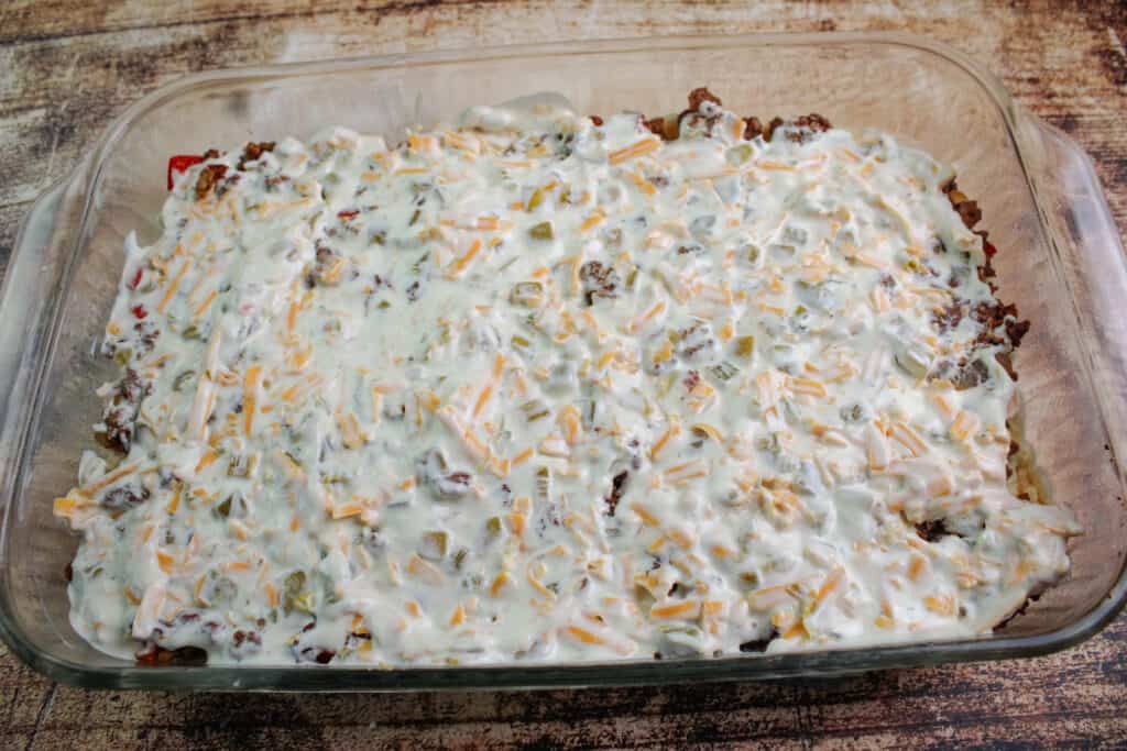 Spring the creamy mixture over the meat mixture for cattle drive casserole .