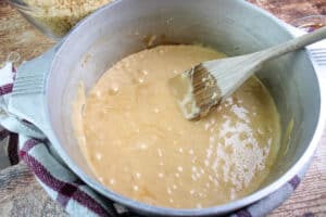In a large pot melted butter , cookie butter and mini marshmallows