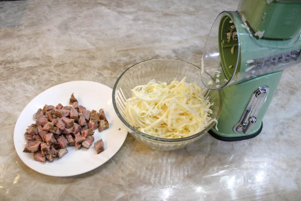 The cheese grated and steak cubed for leftover steak quesadillas