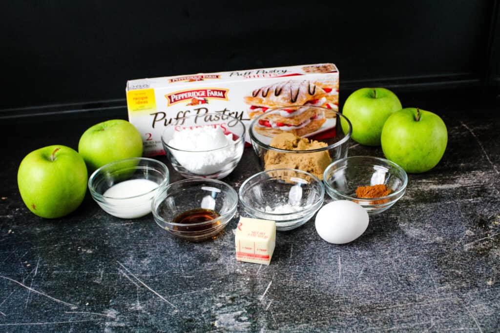 All of the ingredients needed to make apple turnovers with puff pastry