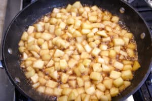Thea apple filling for turnovers in a skillet , cooked and cooling