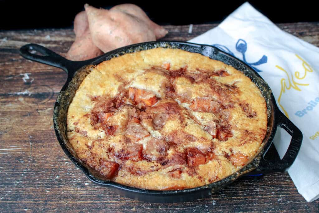 Cooked easy sweet potato cobbler in a cast iron skillet