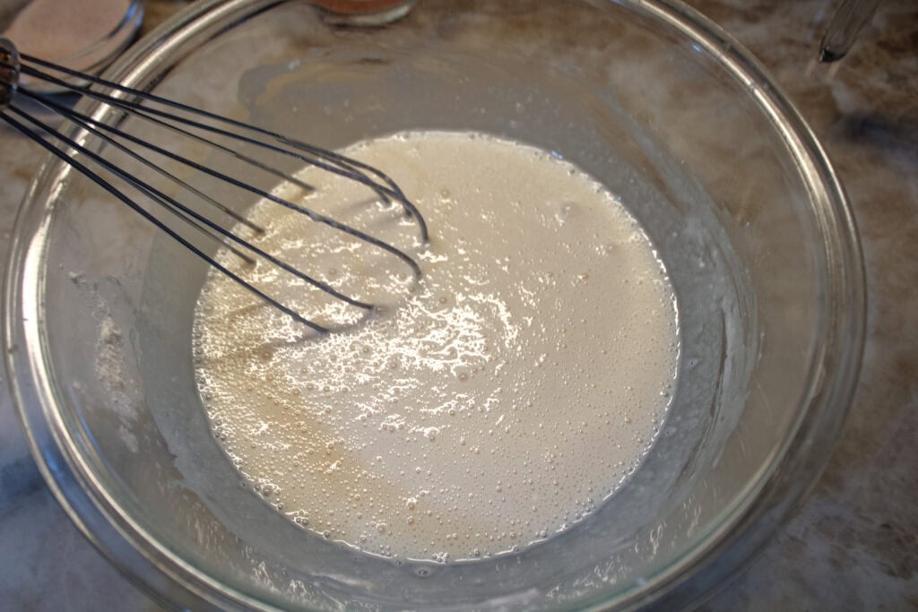 The cobbler crust mixed together in a clear mixing bowl 