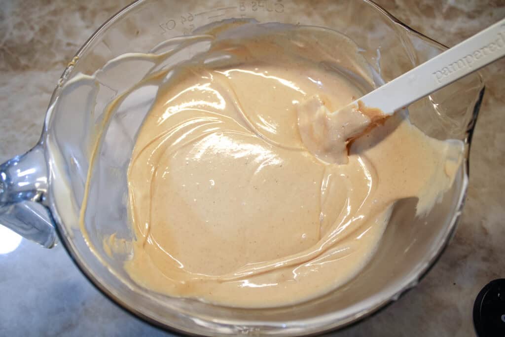 Melted almond bard and peanut butter combined for Tiger Butter 