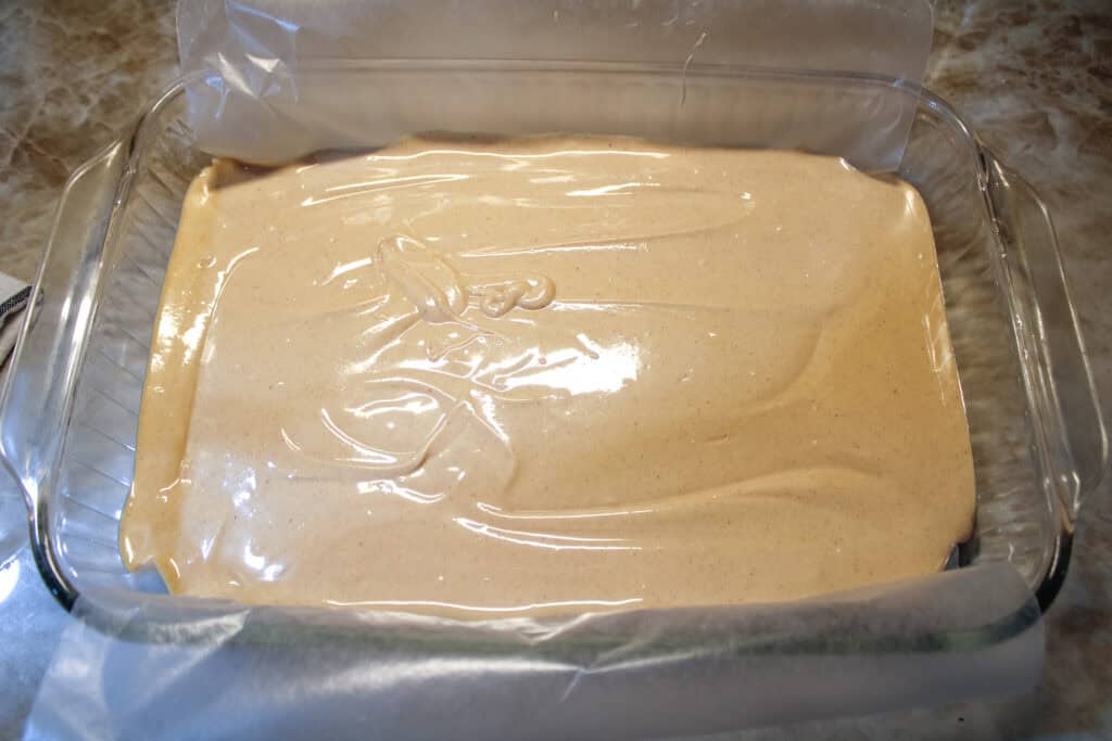 The peanut butter base spread into a wax paper line pan 