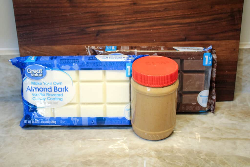 The ingredients for Tiger Butter -Vanilla Almond Bar, Chocolate almond bark, creamy peanut butter 