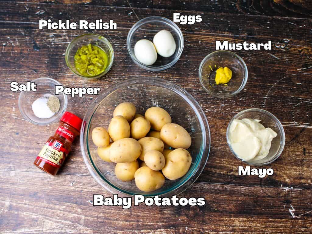 The ingredients for deviled potatoes . Baby potatoes , mayo , mustard , eggs , pickle relish , salt , pepper and smoked paprika . 