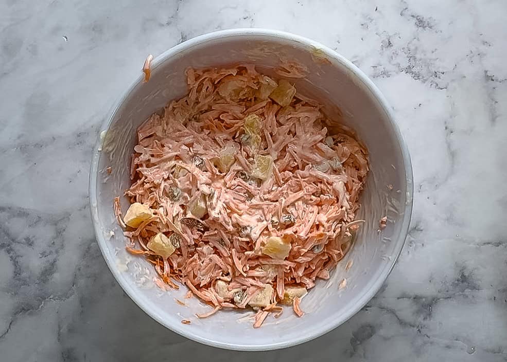 The old fashioned  carrot salad in mixing bow 